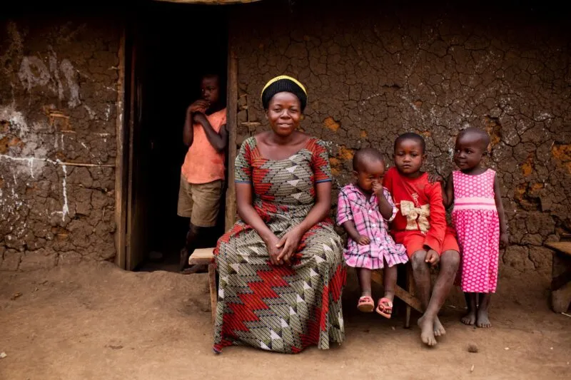 lady siiting with her kids in rural area 
